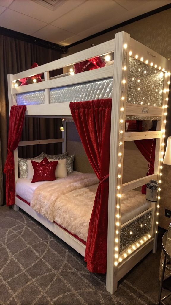 a Hollywood glamour themed bunk bed with luxurious fabrics, mirrored accents, and dramatic lighting.